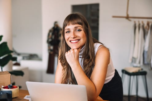 iStock_1411216718_store_owner_smiling iStock_1411216718_store_owner_smiling